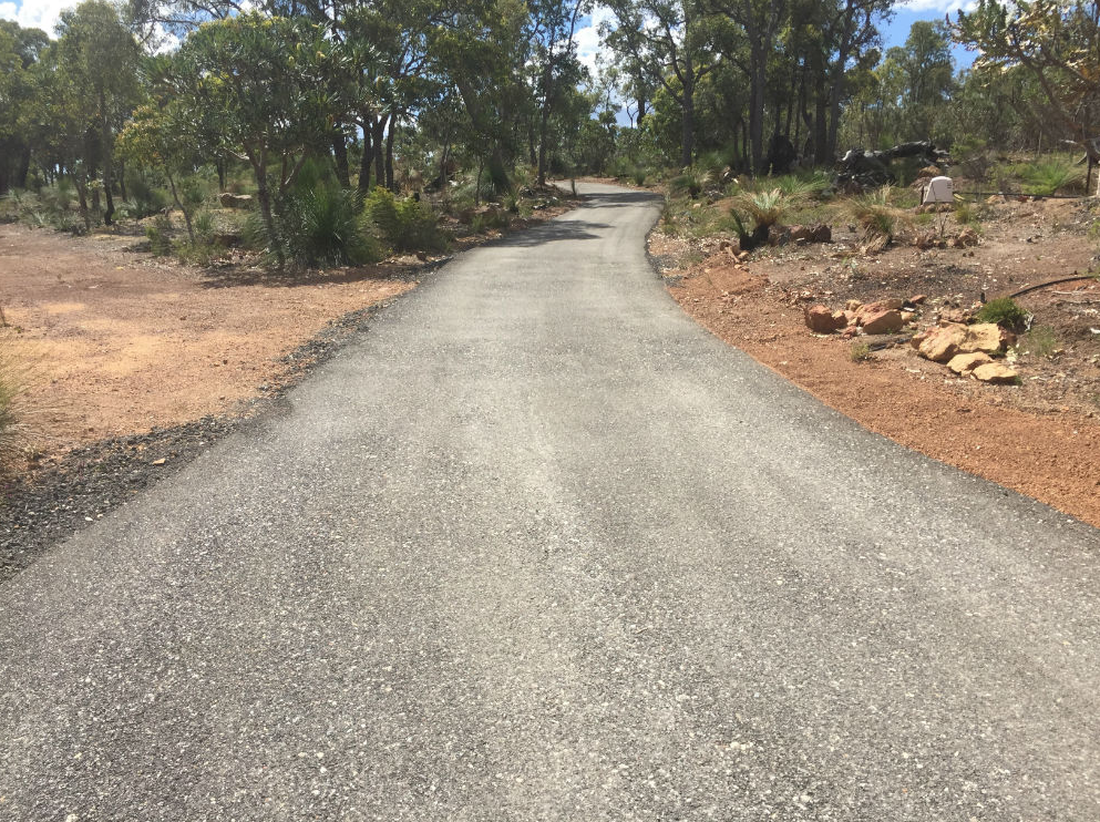 This is a photo of a hot spray & seal bitumen driveway which is in the process of being installed by Southport Surfacing Solutions 