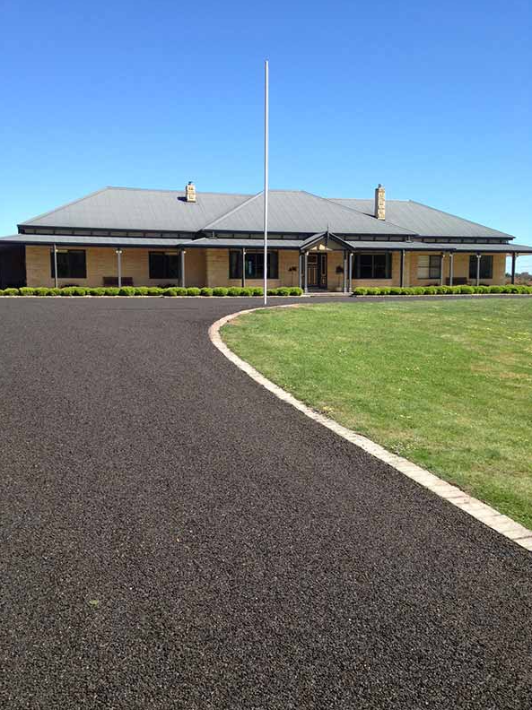 This is a photo of an asphalt driveway which has been installed by Southport Surfacing Solutions 
