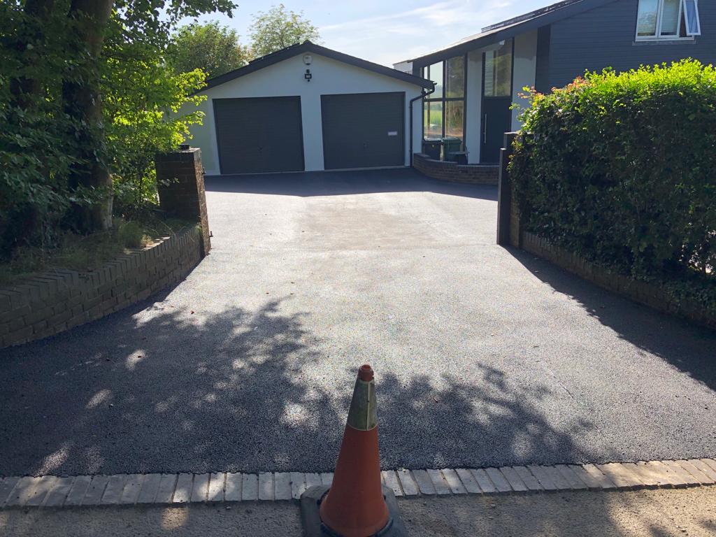 This is a photo of a bitumen driveway which is in the process of being installed by Southport Surfacing Solutions